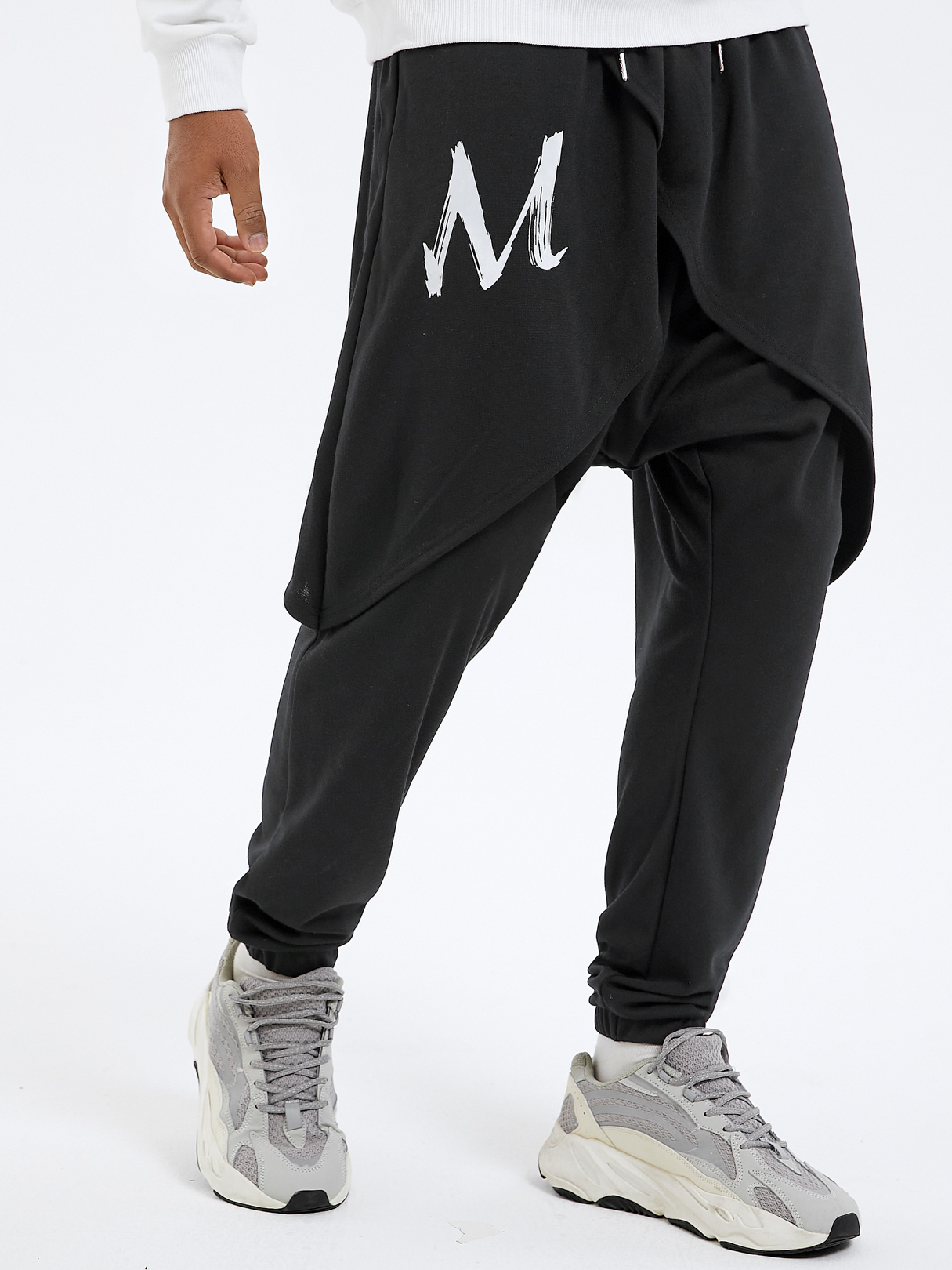 Men Casual Letter Print Tiered Design Loose Harem Pants